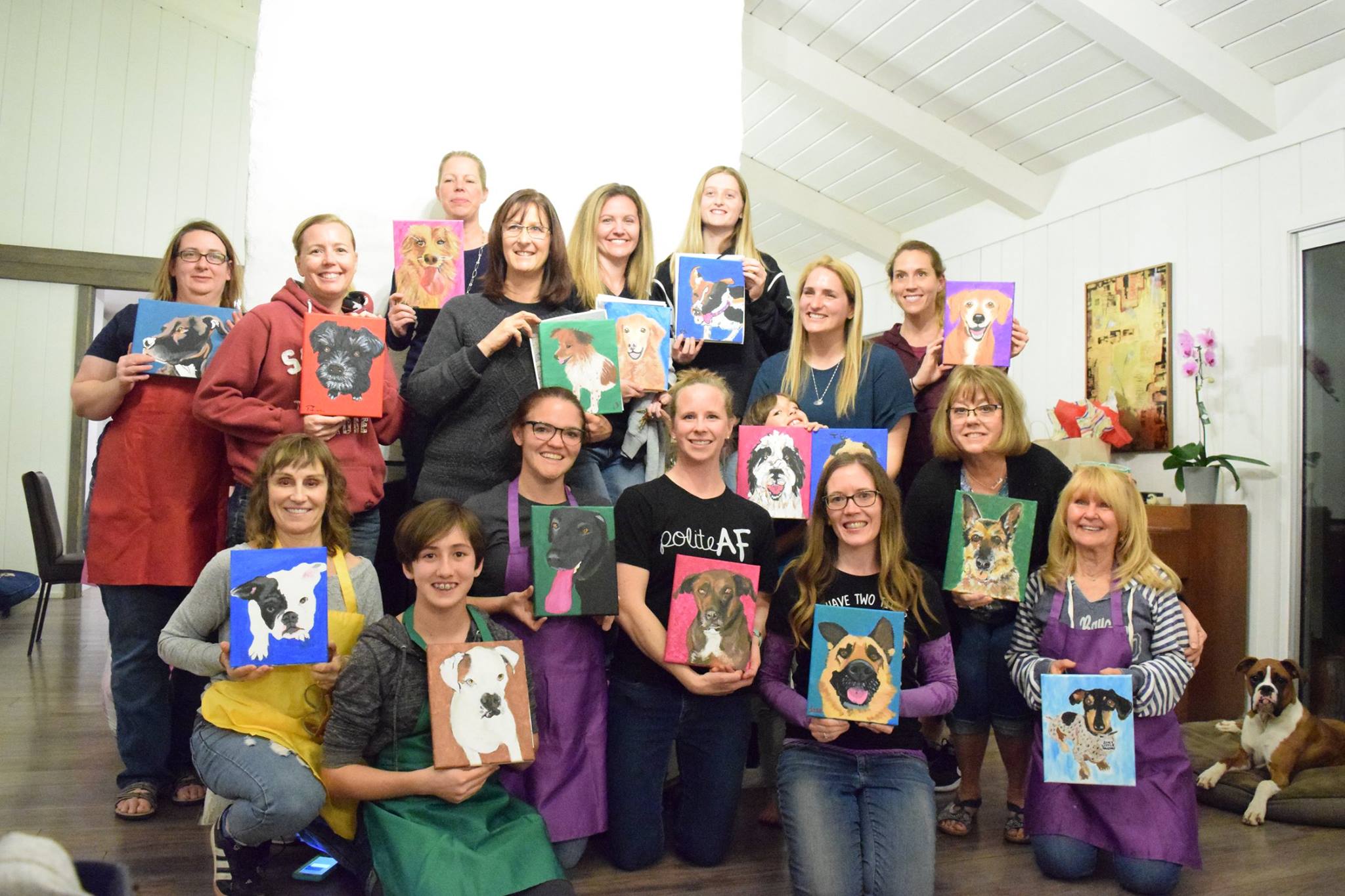 people holding paintings of their pets thorn beer